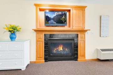 fireplace with mounted TV