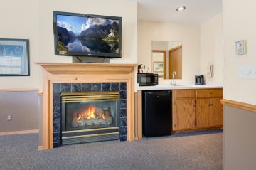 fireplace and TV Mounted with kitchenet